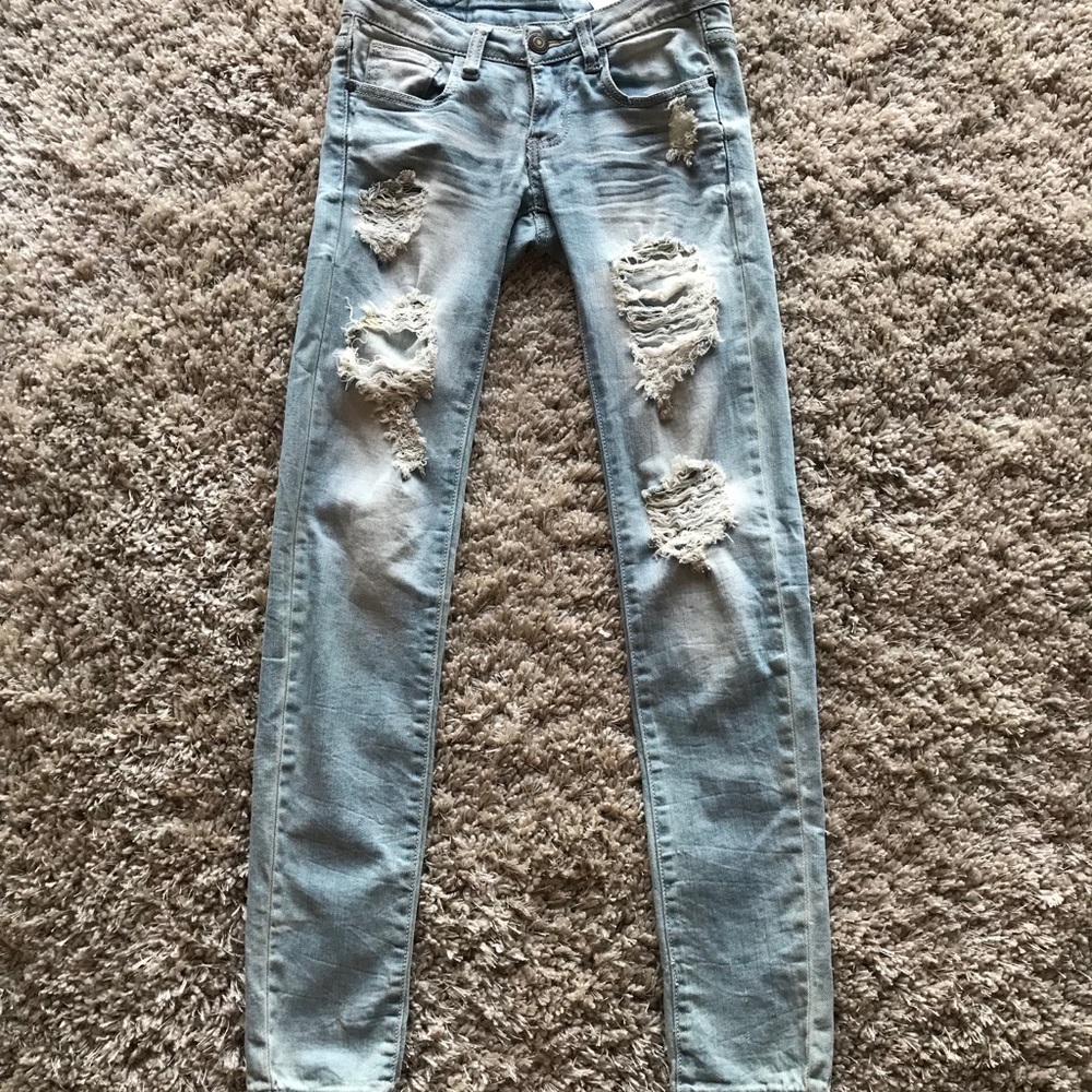 Light washed stretchy low rise distressed jeans